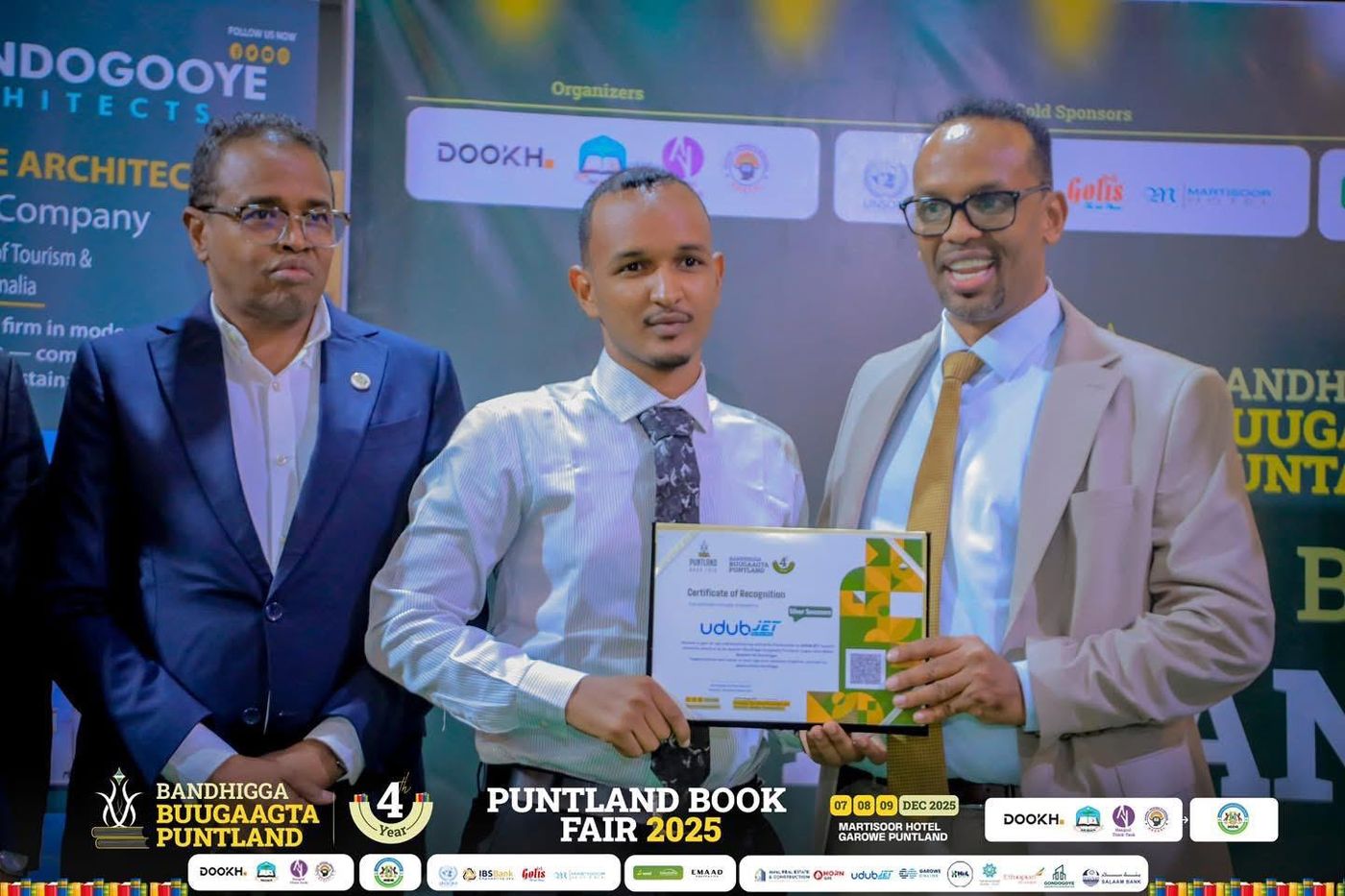 udubJET receiving a Certificate of Recognition as Silver Sponsor of the Puntland Book Fair 2025 in Garowe