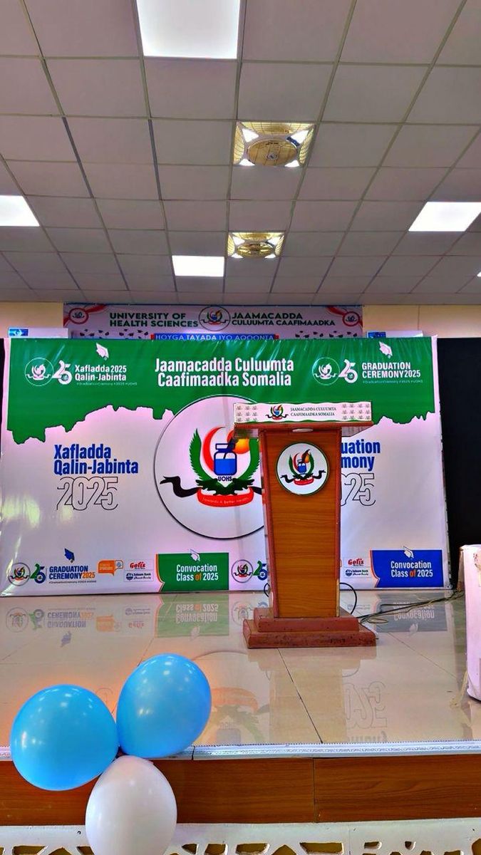 Printed stage backdrop for the 2025 graduation ceremony at the University of Health Sciences Somalia