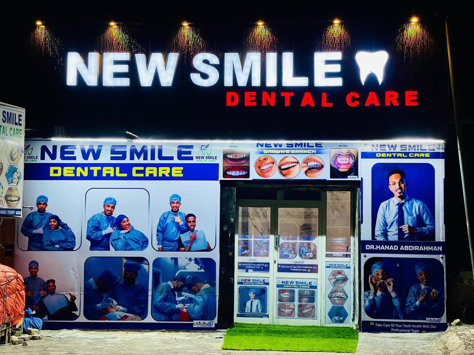 Illuminated storefront signage and printed facade panels for New Smile Dental Care, Garowe